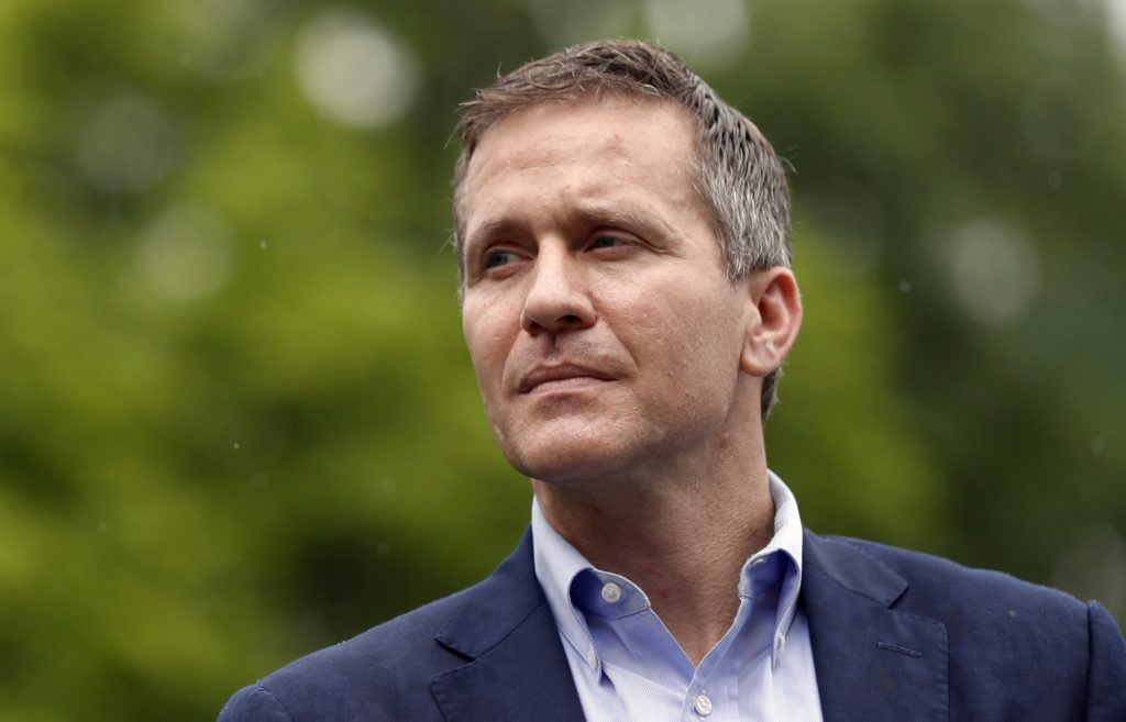 FILE - In this May 17, 2018 file photo, Missouri Gov. Eric Greitens looks on before speaking at an event near the capitol in Jefferson City, Mo. Allegations of sexual misconduct and campaign finance violations against Greitens have been shared with federal authorities by both a private attorney and a key lawmaker, according to testimony Thursday, May 24, 2018, during a legislative hearing by a special committee considering whether to recommend impeachment. (AP Photo/Jeff Roberson, File)