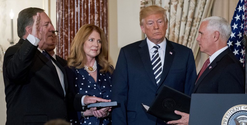 Vice President Mike Pence, right, swears in Secretary of State Mike Pompeo, during a ceremonial swearing in at the State Department, Wednesday, May 2, 2018, in Washington, as President Donald Trump, Pompeo's wife, Susan and son Nicholas, look on. (AP Photo/Andrew Harnik)