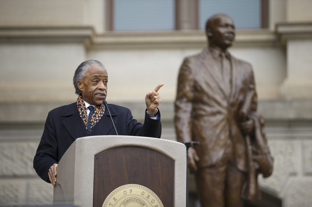 Reverend Al Sharpton addresses the crowd at the capital during the March for Humanity marking the 50th anniversary of Rev. Martin Luther King Jr.'s assassination which commenced at Ebenezer Baptist Church and concluded at the state capital, Monday, Apr. 9, 2018, in Atlanta. (AP Photo/Todd Kirkland)