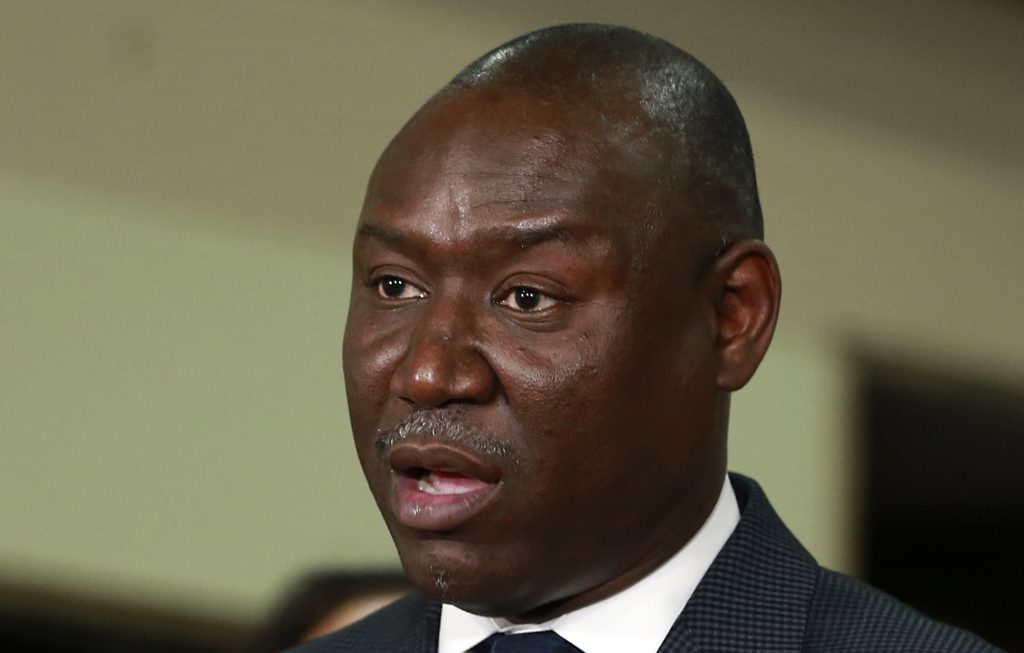 Attorney Benjamin Crump, who represents the family of police shooting victim Stephon Clark, discusses the findings of an independent autopsy during a news conference, Friday, March 30, 2018, in Sacramento, Calif. Over the years, Crump has represented the relatives of other unarmed black men fatally shot by police in other parts of the country. (AP Photo/Rich Pedroncelli)