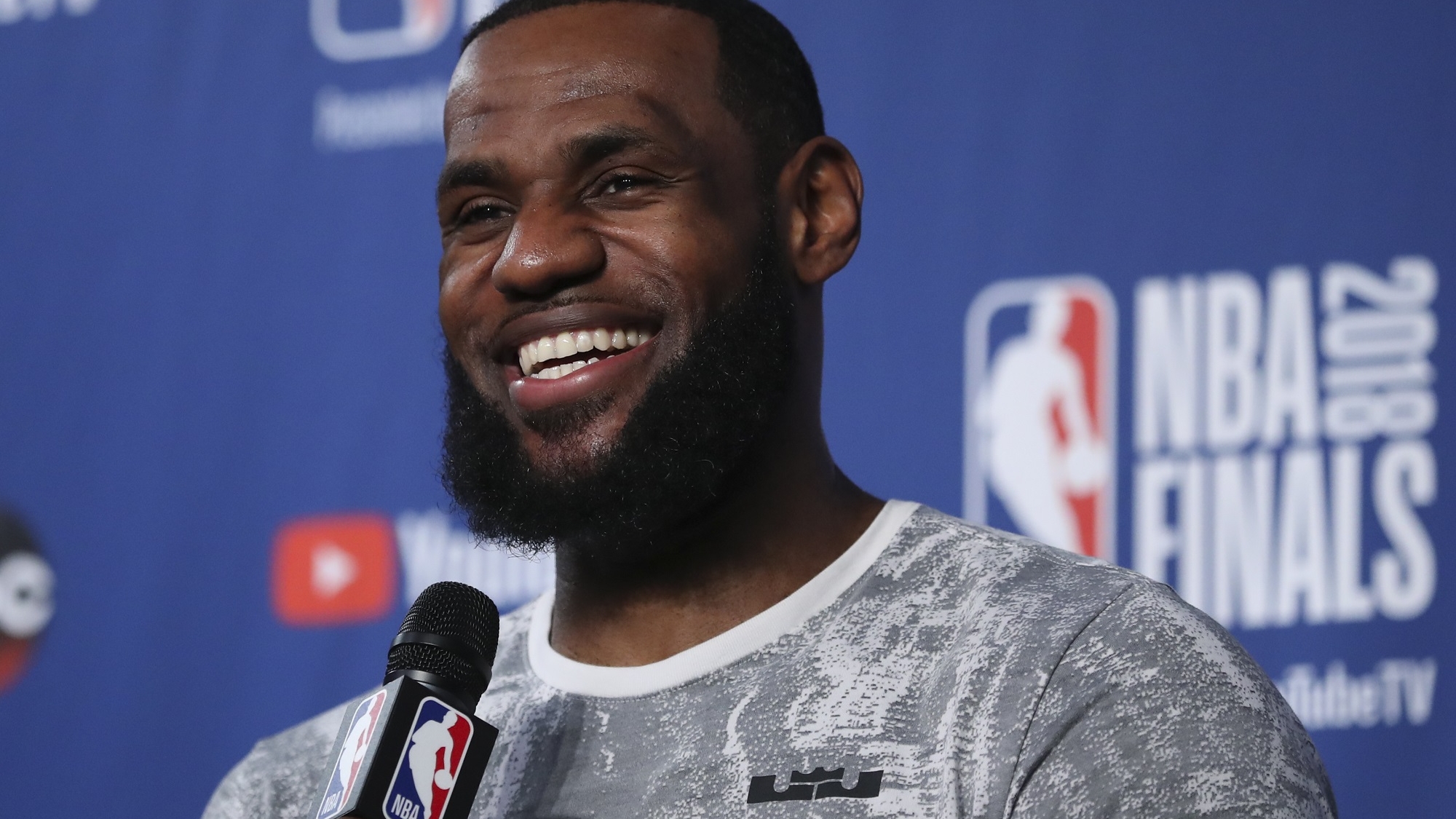 Cleveland Cavaliers forward LeBron James takes questions at a press conference after the basketball team's practiced during the NBA Finals, Thursday, June 7, 2018, in Cleveland. The Warriors lead the series 3-0 with Game 4 on Friday. (AP Photo/Carlos Osorio)