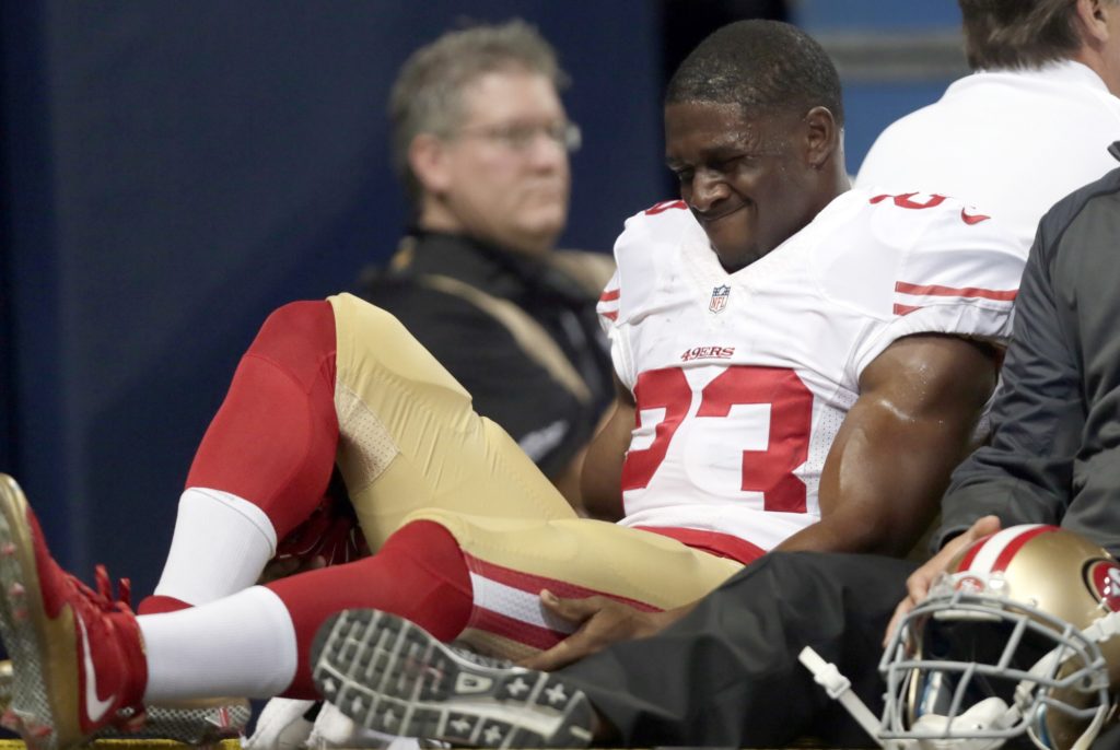 San Francisco 49ers running back Reggie Bush is taken off on a cart during the first quarter of an NFL football game against the St. Louis Rams Sunday, Nov. 1, 2015, in St. Louis. (AP Photo/Tom Gannam)