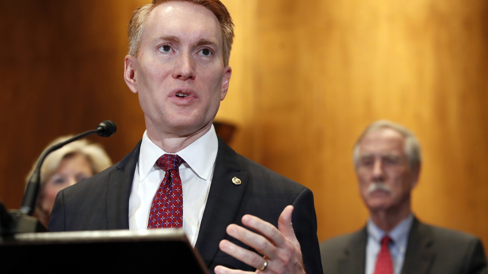 Sen. James Lankford, R-Okla., left, with Sen. Angus King, I-Maine, right, speaks about immigration and the Deferred Action for Childhood Arrivals (DACA) program Wednesday, Feb. 7, 2018, on Capitol Hill in Washington. (AP Photo/Jacquelyn Martin)