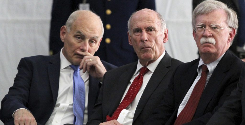 White House chief of staff John Kelly, left, sits with Director of National Intelligence Dan Coats, and national security adviser John Bolton, as President Donald Trump attends a Change of Command ceremony at the U.S. Coast Guard Headquarters, Friday, June 1, 2018, in Washington. (AP Photo/Jacquelyn Martin)