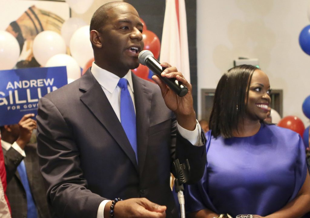 Andrew Gillum and his wife, R. Jai Gillum addresses his supporters after Andrew Gillum won the Democratic primary for governor on Tuesday, Aug. 28, 2018, in Tallahassee, Fla. Gillum defeated former U.S. Rep. Gwen Graham, the daughter of former U.S. Sen. Bob Graham and four other candidates. (AP Photo/Steve Cannon)