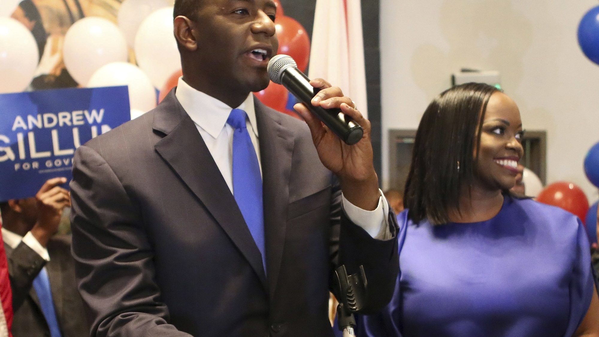 Andrew Gillum and his wife, R. Jai Gillum addresses his supporters after Andrew Gillum won the Democratic primary for governor on Tuesday, Aug. 28, 2018, in Tallahassee, Fla. Gillum defeated former U.S. Rep. Gwen Graham, the daughter of former U.S. Sen. Bob Graham and four other candidates. (AP Photo/Steve Cannon)