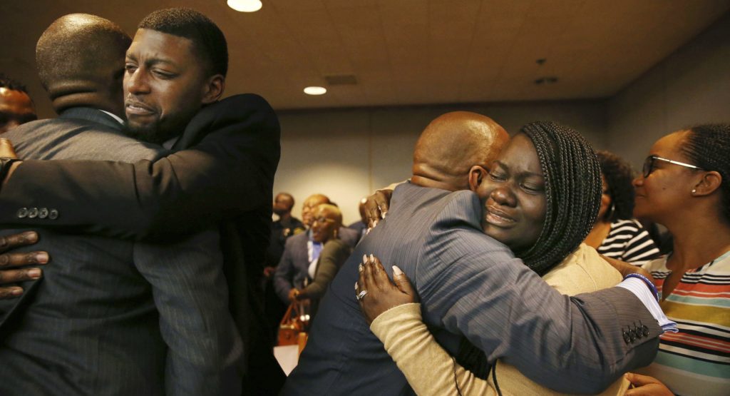 Odell Edwards and Charmaine Edwards, parents of Jordan Edwards, react to a guilty of murder verdict during a trial of fired Balch Springs police officer Roy Oliver, who was charged with the murder of 15-year-old Jordan Edwards, at the Frank Crowley Courts Building in Dallas on Tuesday, Aug. 28, 2018. (Rose Baca/The Dallas Morning News via AP, Pool)