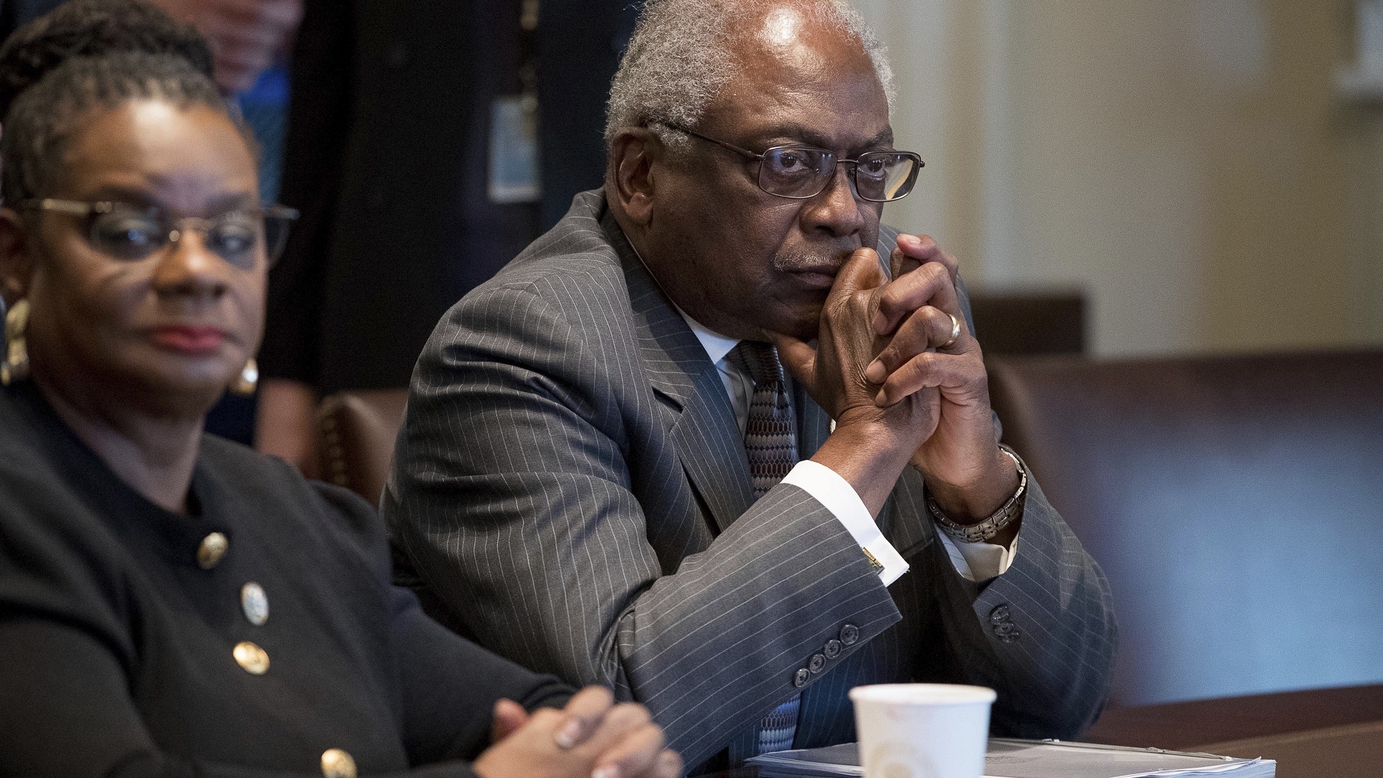 Rep. Gwen Moore, D-Wis., left, House Assistant Minority Leader James Clyburn of S.C., and other members of the Congressional Black Caucus meet with President Donald Trump in the Cabinet Room of the White House in Washington, Wednesday, March 22, 2017. (AP Photo/Andrew Harnik)