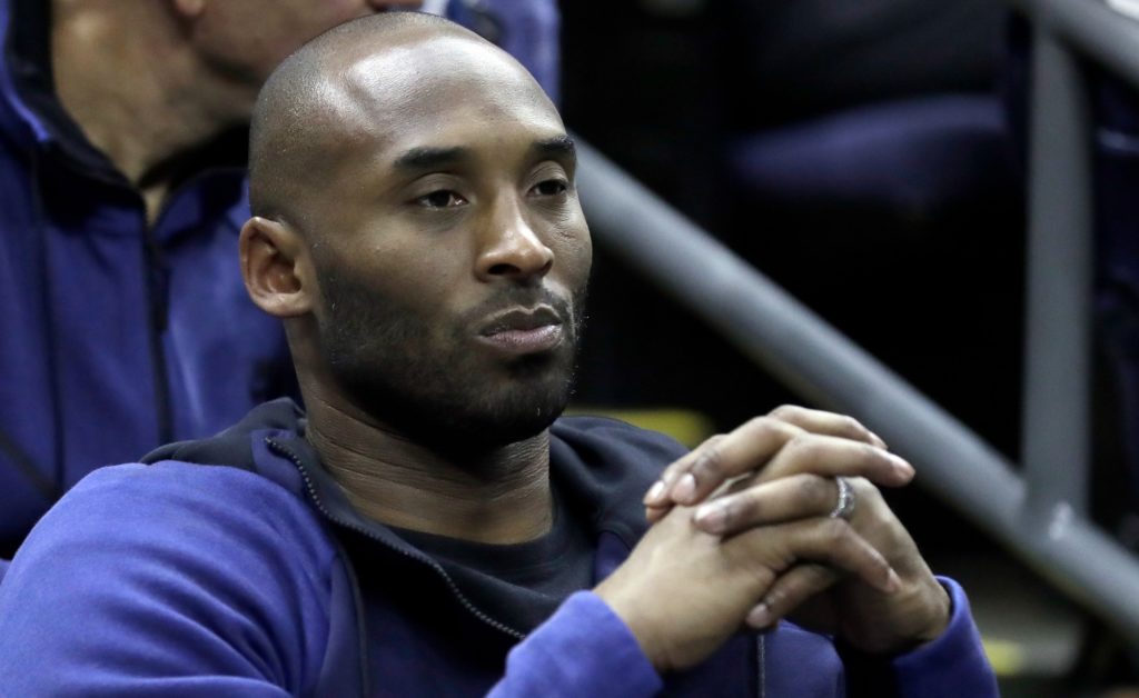 Former Los Angeles Lakers' Kobe Bryant watches from the stands during the first half in the semifinals of the women's NCAA Final Four college basketball tournament game between Connecticut and Notre Dame, Friday, March 30, 2018, in Columbus, Ohio. (AP Photo/Ron Schwane)