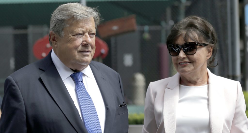 Viktor and Amalija Knavs listen as their attorney makes a statement in New York, Thursday, Aug. 9, 2018. First Lady Melania Trump's parents have been sworn in as U.S. citizens. A lawyer for the Knavs says the Slovenian couple took the citizenship oath on Thursday in New York City. They had been living in the U.S. as permanent residents. (AP Photo/Seth Wenig)
