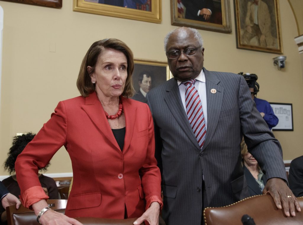 House Democratic Leader Nancy Pelosi of California, with Assistant Minority Leader Rep. James Clyburn, D-S.C., right, arrives at the House Rules Committee to speak in support of AARP and other consumer health groups as the GOP majority is shaping the final version of the Republican health care bill before it goes to the floor for debate and a vote, at the Capitol in Washington, Wednesday, March 22, 2017. (AP Photo/J. Scott Applewhite)