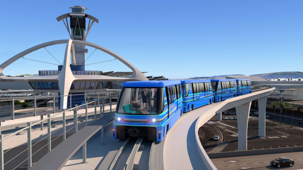 This undated artist's rendering provided by Los Angeles World Airports shows driverless cars on an elevated track passing the Theme Building at Los Angeles International Airport. The Los Angeles City Council Wednesday, April 11, 2018 approved a $4.9-billion contract to design, build and operate the automated people mover at LAX. The elevated 2¼-mile system will have driverless electric trains that carry airline passengers between terminals, a transportation center and the Metro light-rail system. It is expected to be operational in 2023. (Los Angeles World Airports via AP)