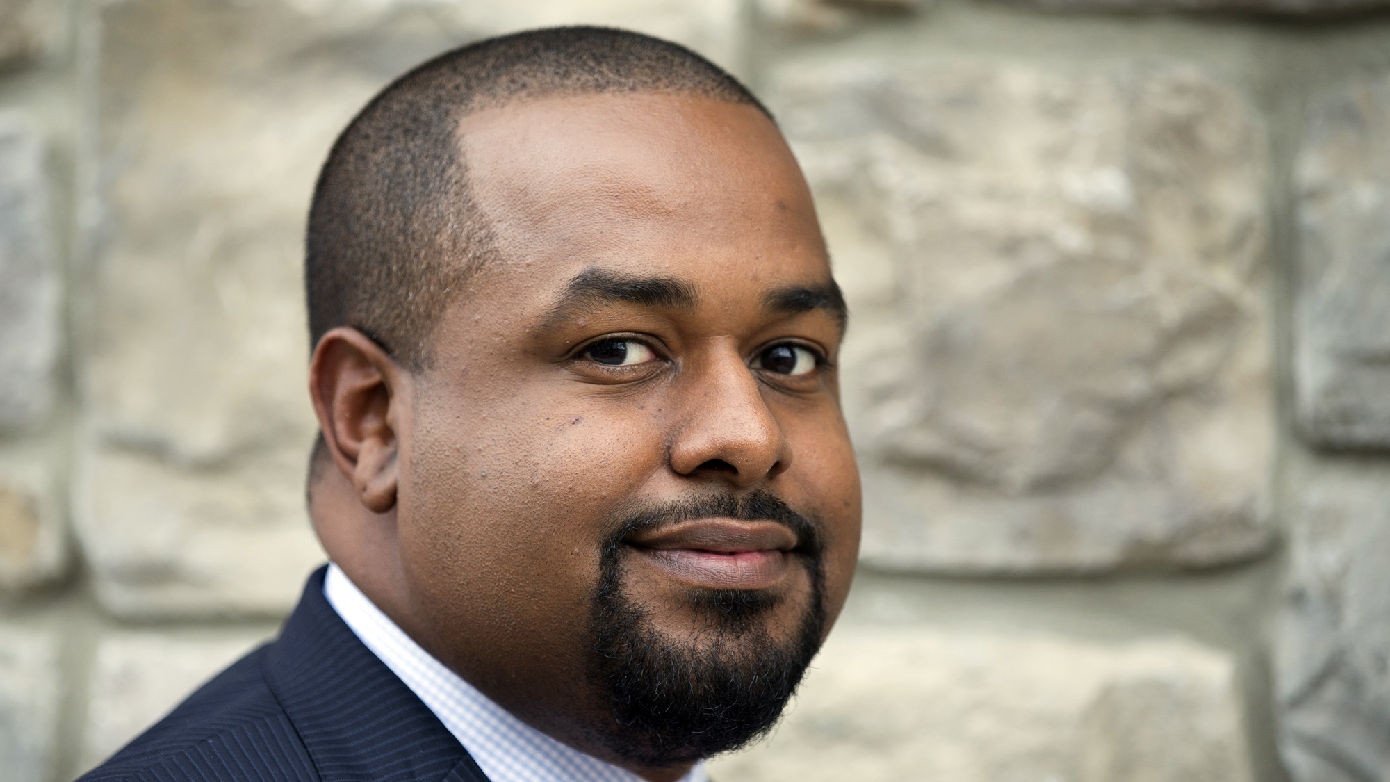Joshua DuBois an informal spiritual adviser to President Barack Obama, poses for a photo in northeast Washington, on Wednesday, Oct. 16, 2013. Obama is not an overtly religious man. He and his family rarely attend church, and he almost never elaborates in public about his own relationship to his Christian faith. But far away from the public eye, his longtime advisers say, the president has carefully nurtured a sense of spirituality that has served as a grounding mechanism during turbulent times, when the obstacles to governing a deeply divided nation seem nearly insurmountable. "Ive certainly seen the president's faith grow in his time in office," said DuBois. (AP Photo/Manuel Balce Ceneta)