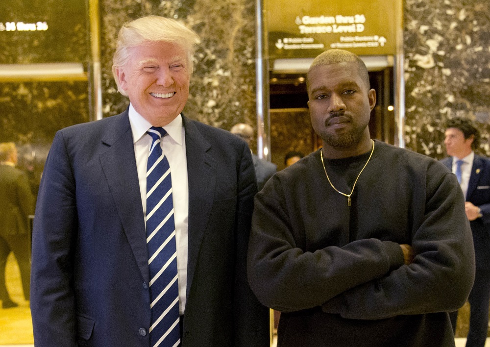 FILE - In this Dec. 13, 2016, file photo, President-elect Donald Trump and Kanye West pose for a picture in the lobby of Trump Tower in New York. Kanye West will visit the White House on Thursday to meet with President Donald Trump and his son-in-law Jared Kushner talk about manufacturing in America, gang violence, prison reform and Chicago violence. (AP Photo/Seth Wenig, File)