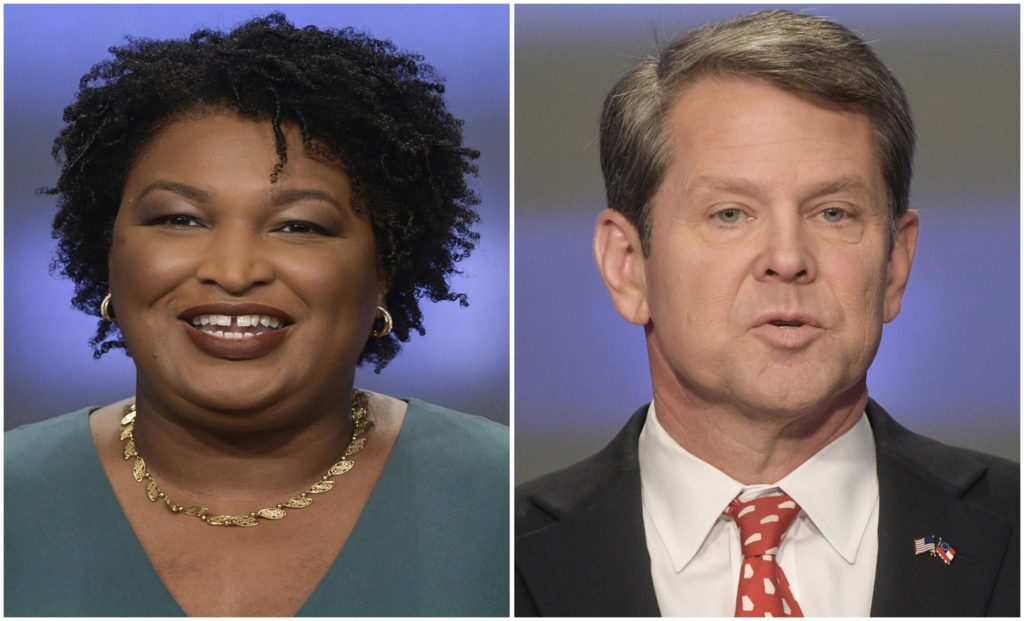 FILE - This combination of May 20, 2018, file photos shows Georgia gubernatorial candidates Stacey Abrams, left, and Brian Kemp in Atlanta. Kemp has unveiled a $90 million proposal for school security focused on mental health and local control. But absent from his plan was any mention of the topic that has dominated the national conversation around school safety: guns. Abrams’ campaign said that gun safety measures are essential to keeping Georgia’s schoolchildren safe. (AP Photos/John Amis, File)