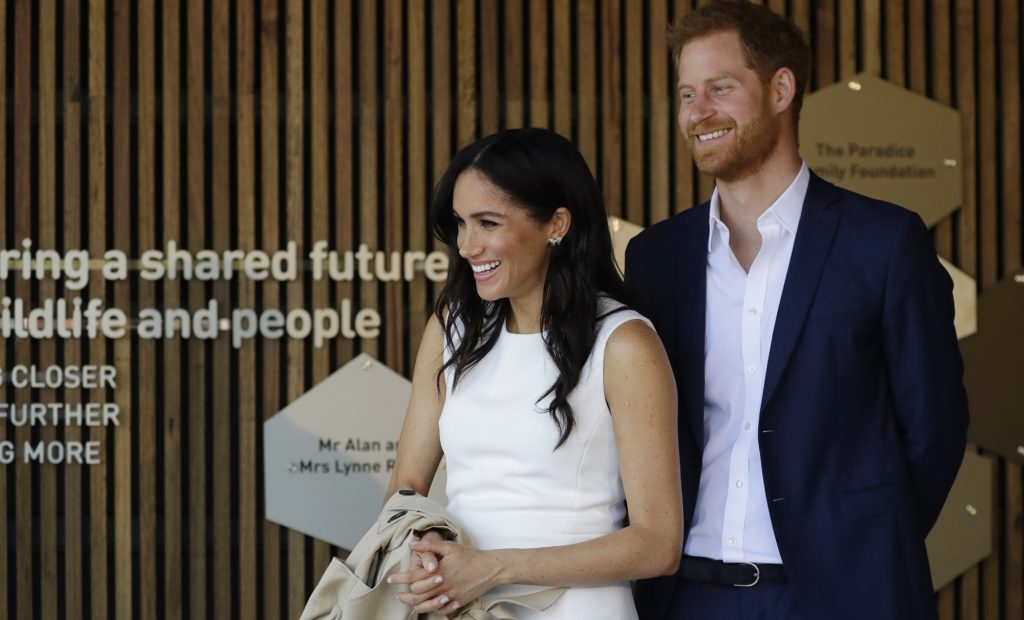Britain's Prince Harry and Meghan, Duchess of Sussex react during a ceremony at Taronga Zoo in Sydney, Australia, Tuesday, Oct. 16, 2018. Prince Harry and his wife Meghan are on a 16-day tour of Australia and the South Pacific.(AP Photo/Kirsty Wigglesworth,Pool)