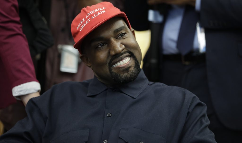 Rapper Kanye West is seated while meeting with President Donald Trump and others in the Oval Office of the White House, Thursday, Oct. 11, 2018, in Washington.  (AP Photo/Evan Vucci)