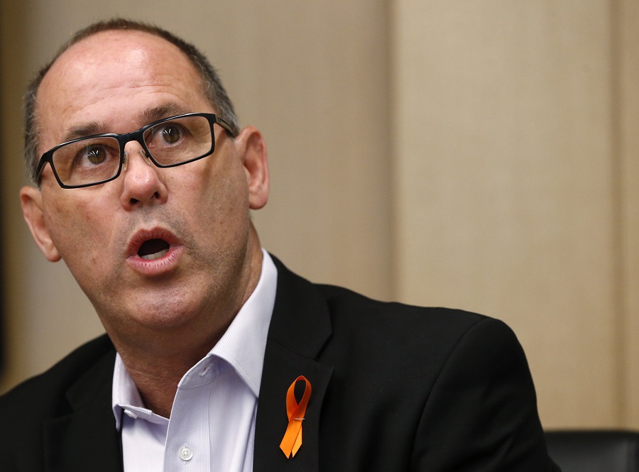 Fred Guttenberg, who's daughter Jaime was killed in the Parkland, Florida, school shootings, speaks during a news conference, Thursday, May 24, 2018, in Miami. Guttenberg and the family of Alex Schachter, another student killed at Parkland, are suing American Outdoor Brands and the store Tactical Supply, claiming they are complicit in the use of an AR-15 style rifle to kill 14 students and three staff members at Marjory Stoneman Douglas High School on Feb. 14. The lawsuit also calls into question a 2001 Florida law that prohibits state and local governments from suing gun manufacturers if their products are used in unlawful ways. The law doesn't mention lawsuits by victims or their families. (AP Photo/Wilfredo Lee)