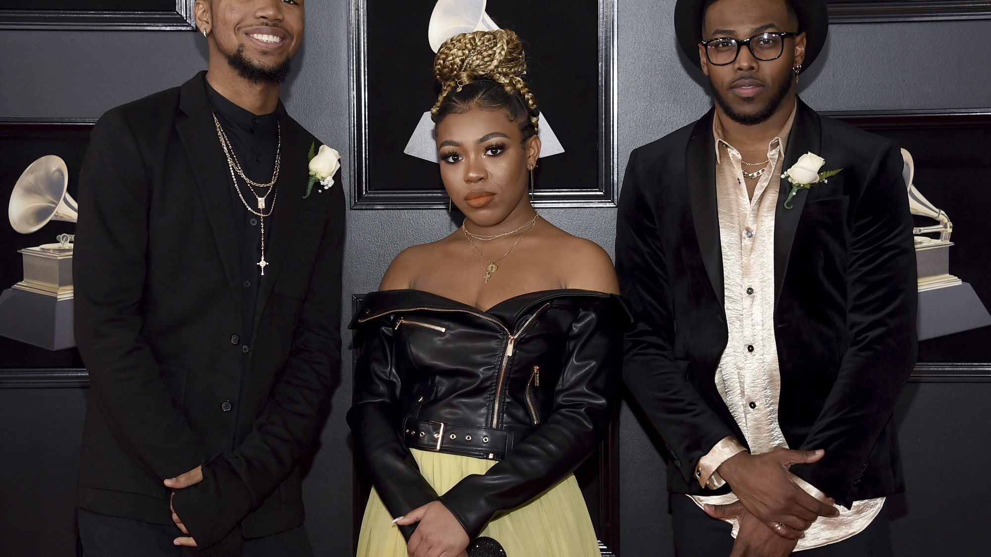 Darrel Walls, from left, Ahjah Walls and Paco Walls of The Walls Group arrive at the 60th annual Grammy Awards at Madison Square Garden on Sunday, Jan. 28, 2018, in New York. (Photo by Evan Agostini/Invision/AP)