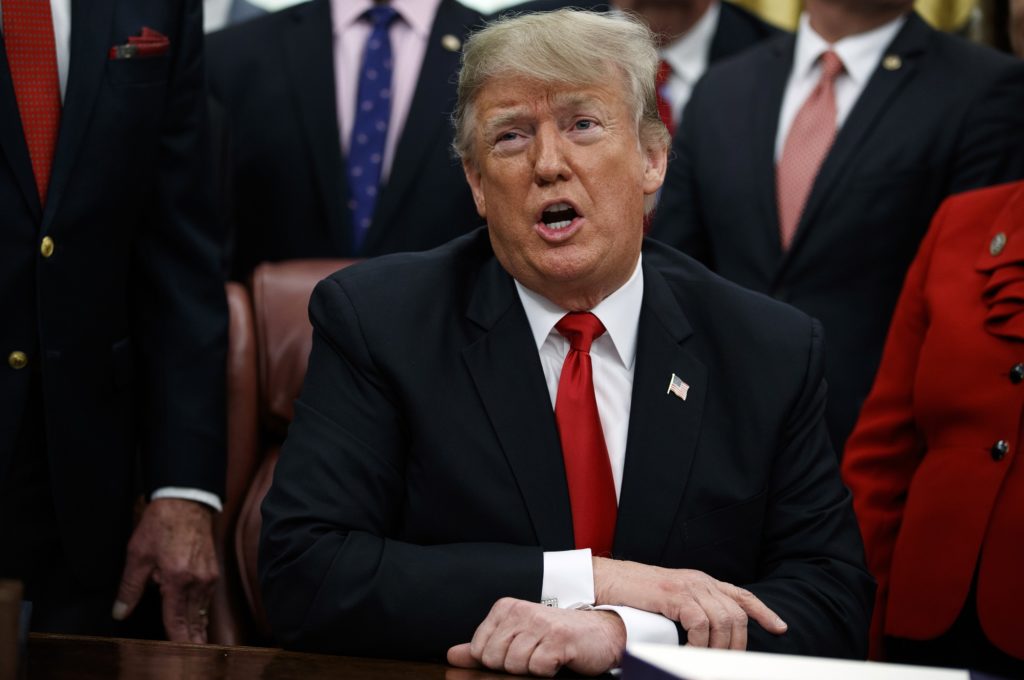 President Donald Trump makes a statement on the possible government shutdown before signing criminal just reform legislation in the Oval Office of the White House, Friday, Dec. 21, 2018, in Washington. (AP Photo/Evan Vucci)