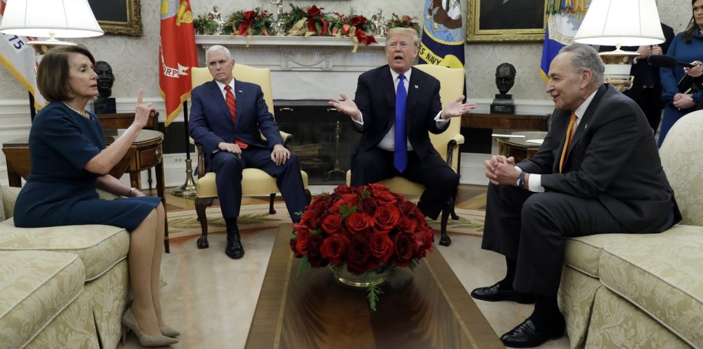 President Donald Trump and Vice President Mike Pence meet with Senate Minority Leader Chuck Schumer, D-N.Y., and House Minority Leader Nancy Pelosi, D-Calif., in the Oval Office of the White House, Tuesday, Dec. 11, 2018, in Washington. (AP Photo/Evan Vucci)