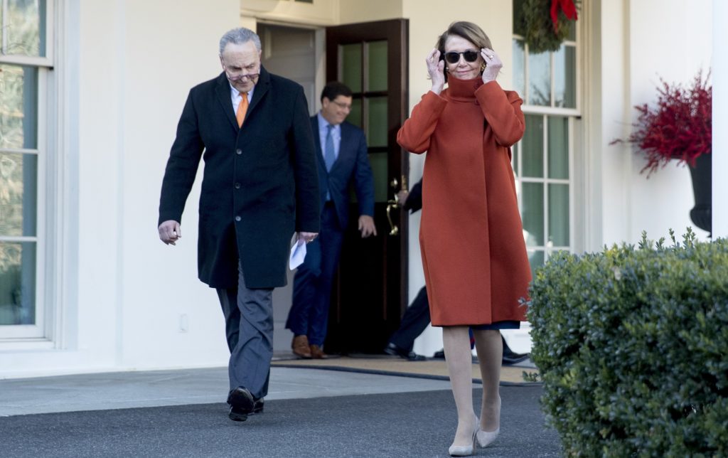 House Minority Leader Nancy Pelosi of Calif., right, and Senate Minority Leader Sen. Chuck Schumer of N.Y., left, walk out of the West Wing to speak to members of the media outside of the White House in Washington, Tuesday, Dec. 11, 2018, following a meeting with President Donald Trump. (AP Photo/Andrew Harnik)