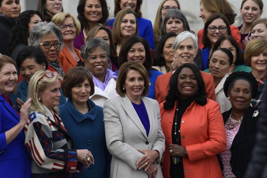 The women of the 116th Congress, including House Speaker Nancy Pelosi of Calif., center front row, pose for a group photo on Capitol Hill in Washington, Friday, Jan. 4, 2019. (AP Photo/Susan Walsh)