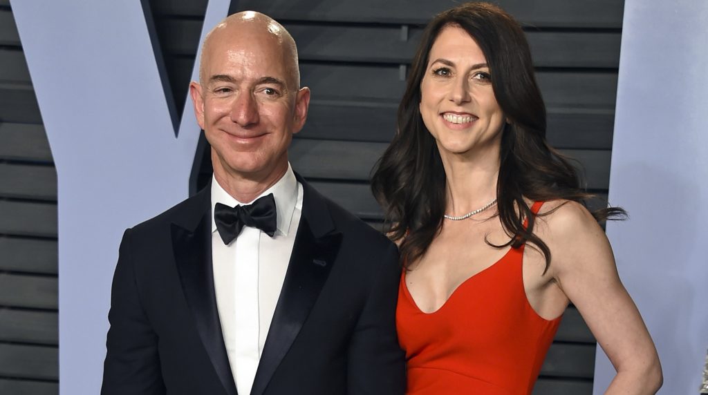 FILE - In this March 4, 2018 file photo, Jeff Bezos and wife MacKenzie Bezos arrive at the Vanity Fair Oscar Party in Beverly Hills, Calif.   Bezos says he and his wife, MacKenzie, have decided to divorce after 25 years of marriage.  Bezos, one of the world’s richest men, made the announcement on Twitter Wednesday, Jan. 9, 2019. (Photo by Evan Agostini/Invision/AP, File)
