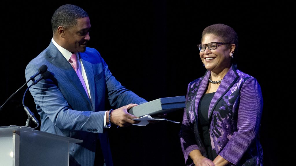 Chairman of the Congressional Black Caucus, Rep. Cedric Richmond, D-La.,hands the gavel to the new Chairman of the Congressional Black Caucus Rep. Karen Bass, D-Calif., during Congressional Black Caucus members swearing-in ceremony ot The Warner Theatre in Washington, Thursday, Jan. 3, 2019. (AP Photo/Jose Luis Magana)