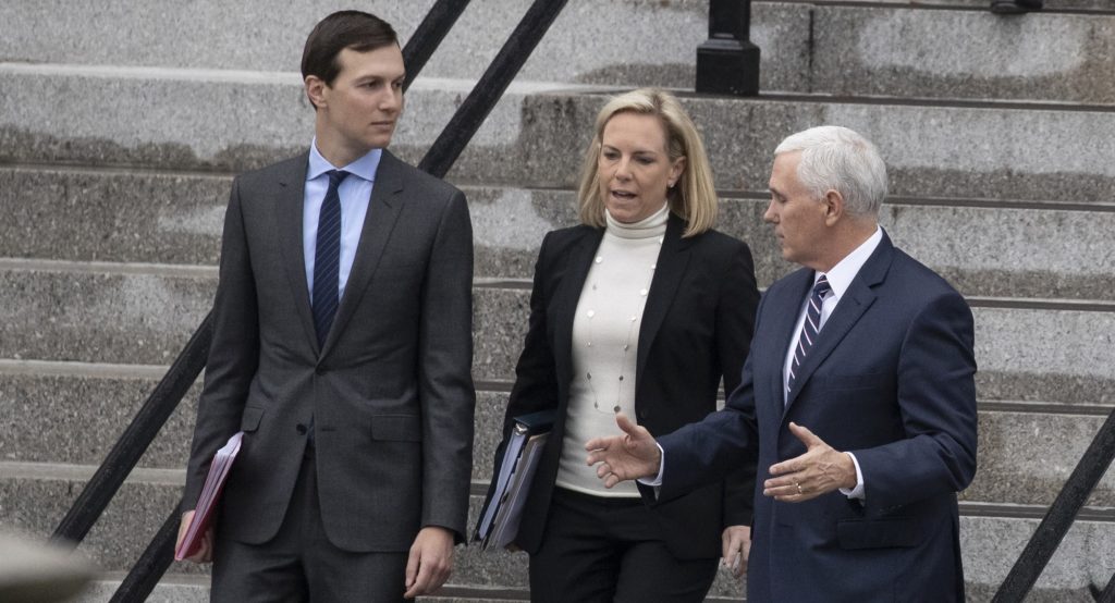 White House Senior Adviser Jared Kushner, left, Homeland Security Secretary Kirstjen Nielsen, and Vice President Mike Pence, talk as they walk down the steps of the Eisenhower Executive Office Building on the White House complex, Saturday, Jan. 5, 2019, in Washington. (AP Photo/Alex Brandon)