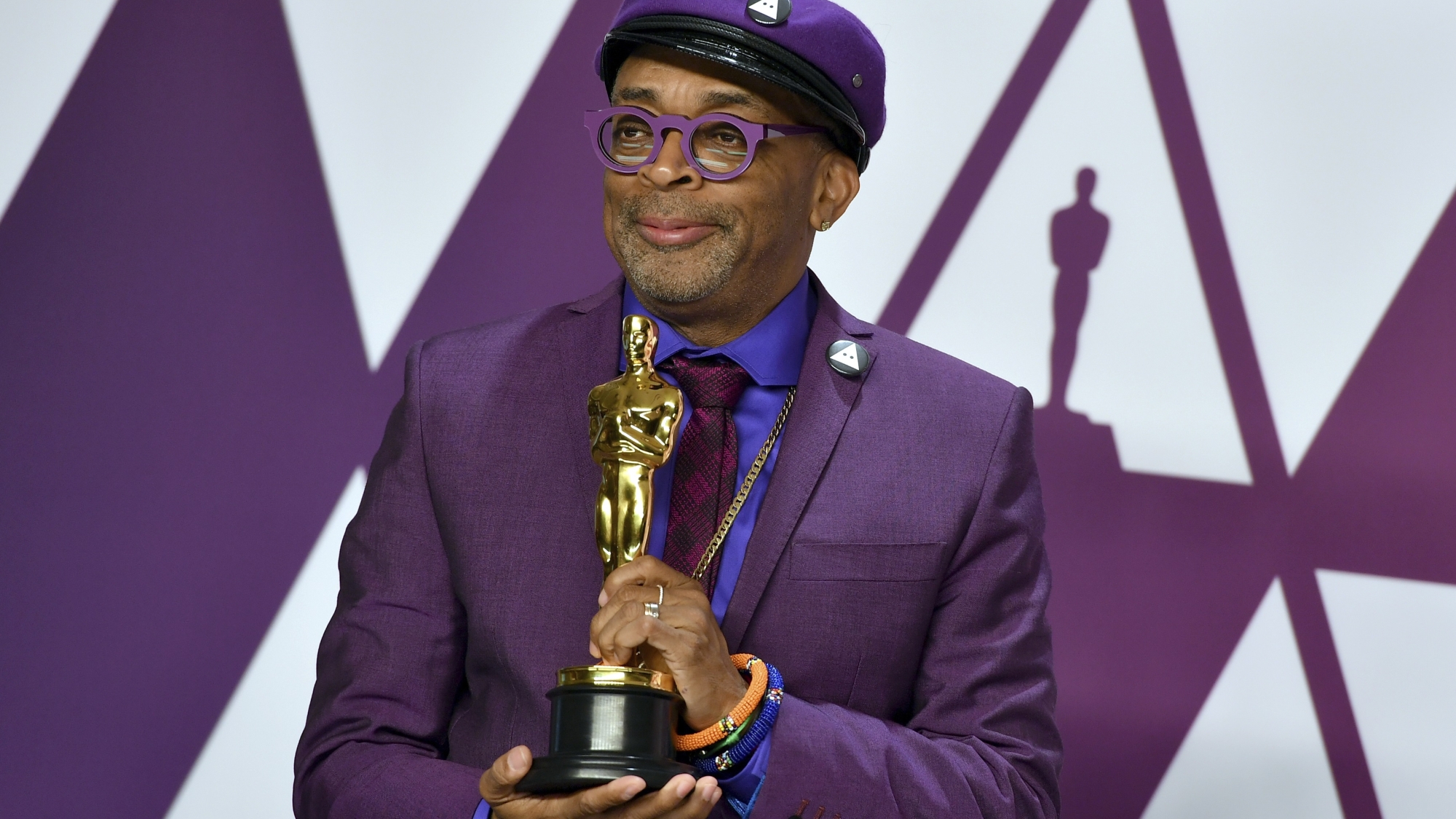 Spike Lee poses with the award for best adapted screenplay for "BlacKkKlansman" in the press room at the Oscars on Sunday, Feb. 24, 2019, at the Dolby Theatre in Los Angeles. (Photo by Jordan Strauss/Invision/AP)