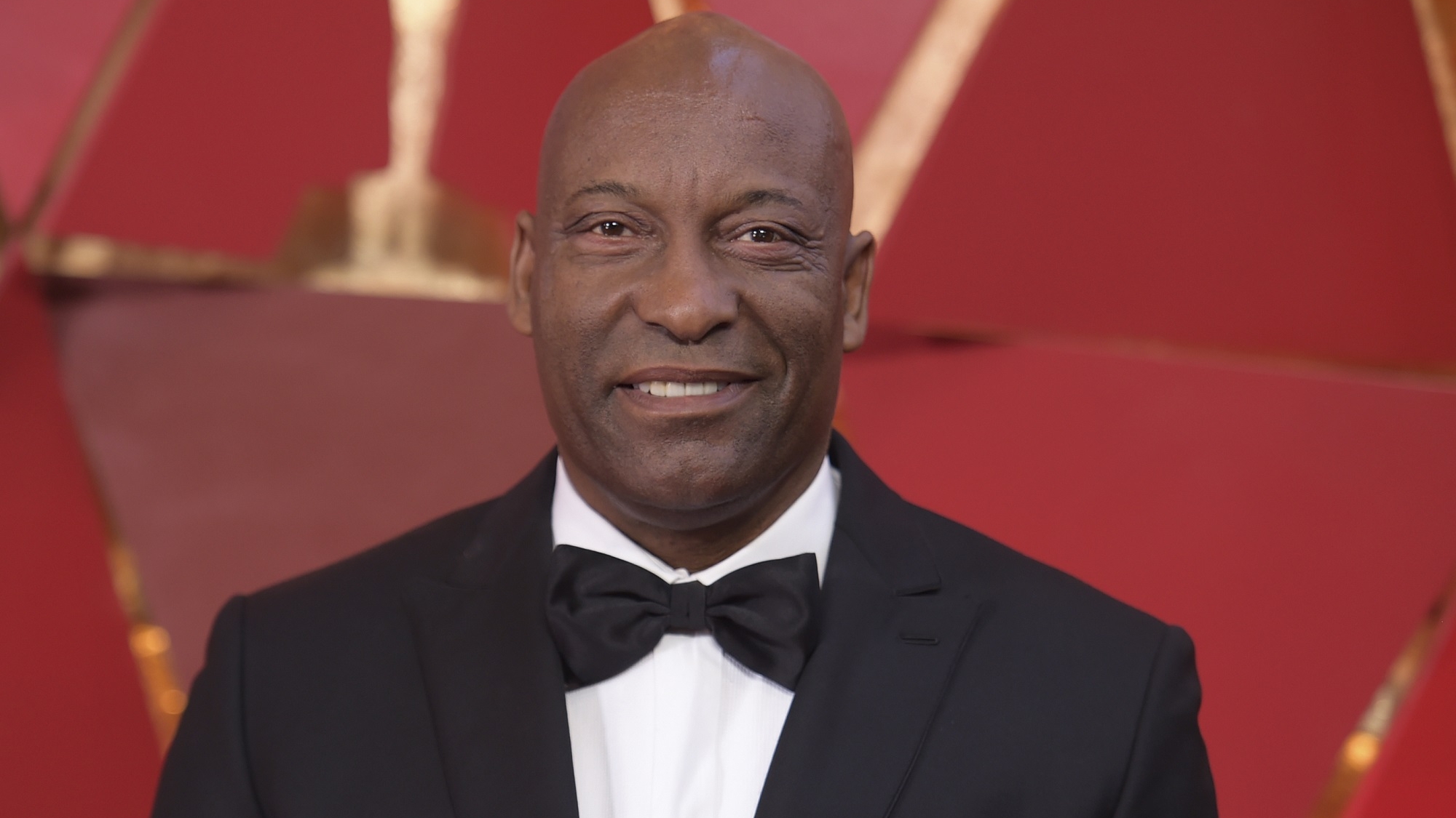 John Singleton arrives at the Oscars on Sunday, March 4, 2018, at the Dolby Theatre in Los Angeles. (Photo by Richard Shotwell/Invision/AP)