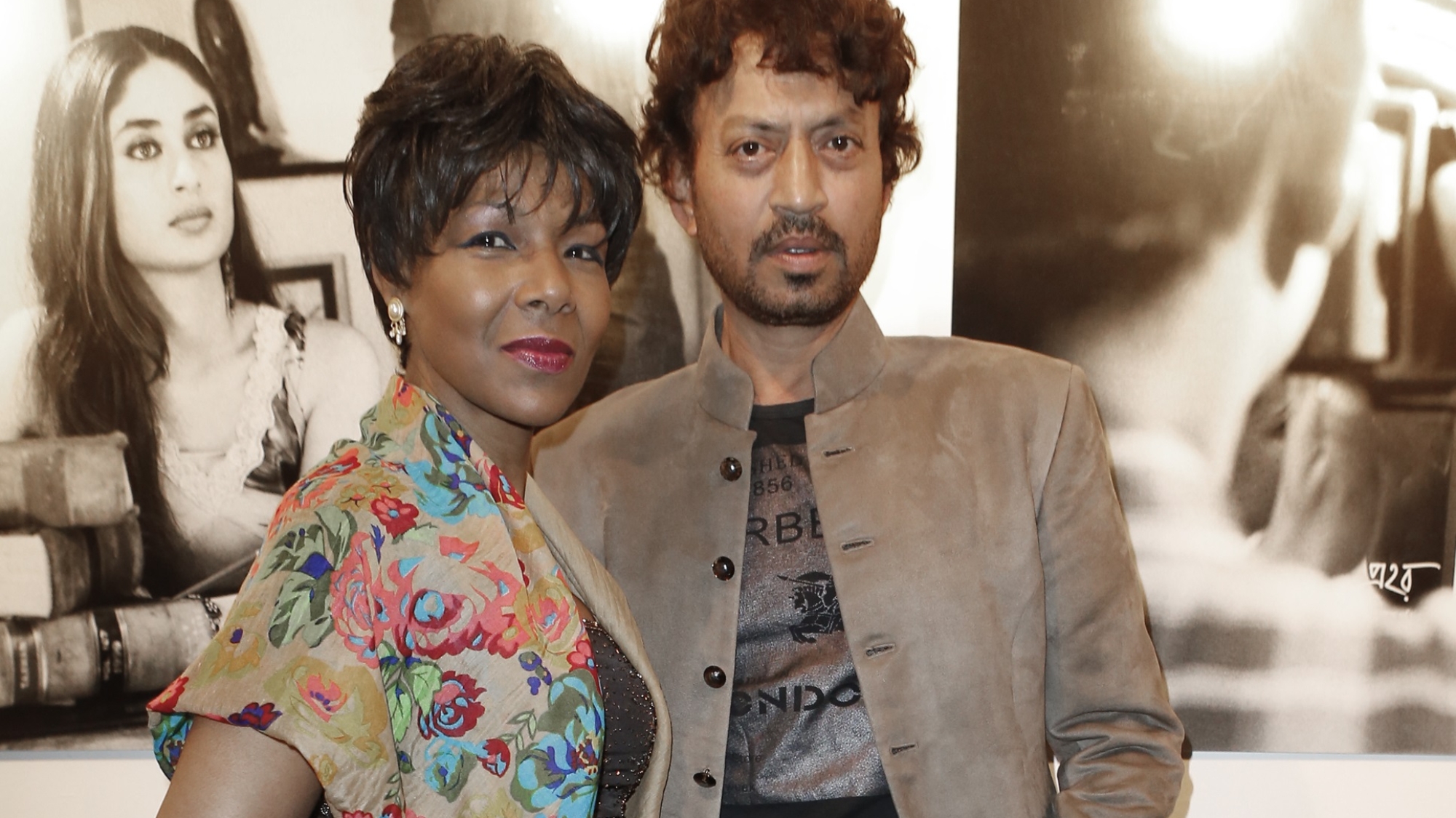 Actor Irrfan Khan, right, and Euzhan Palcy, film director, writer and producer from the French West Indies pose for photographers as they arrive for Extravagant India!, the international Indian Film Festival in Paris, Tuesday Oct. 15, 2013. (AP Photo/Jacques Brinon)