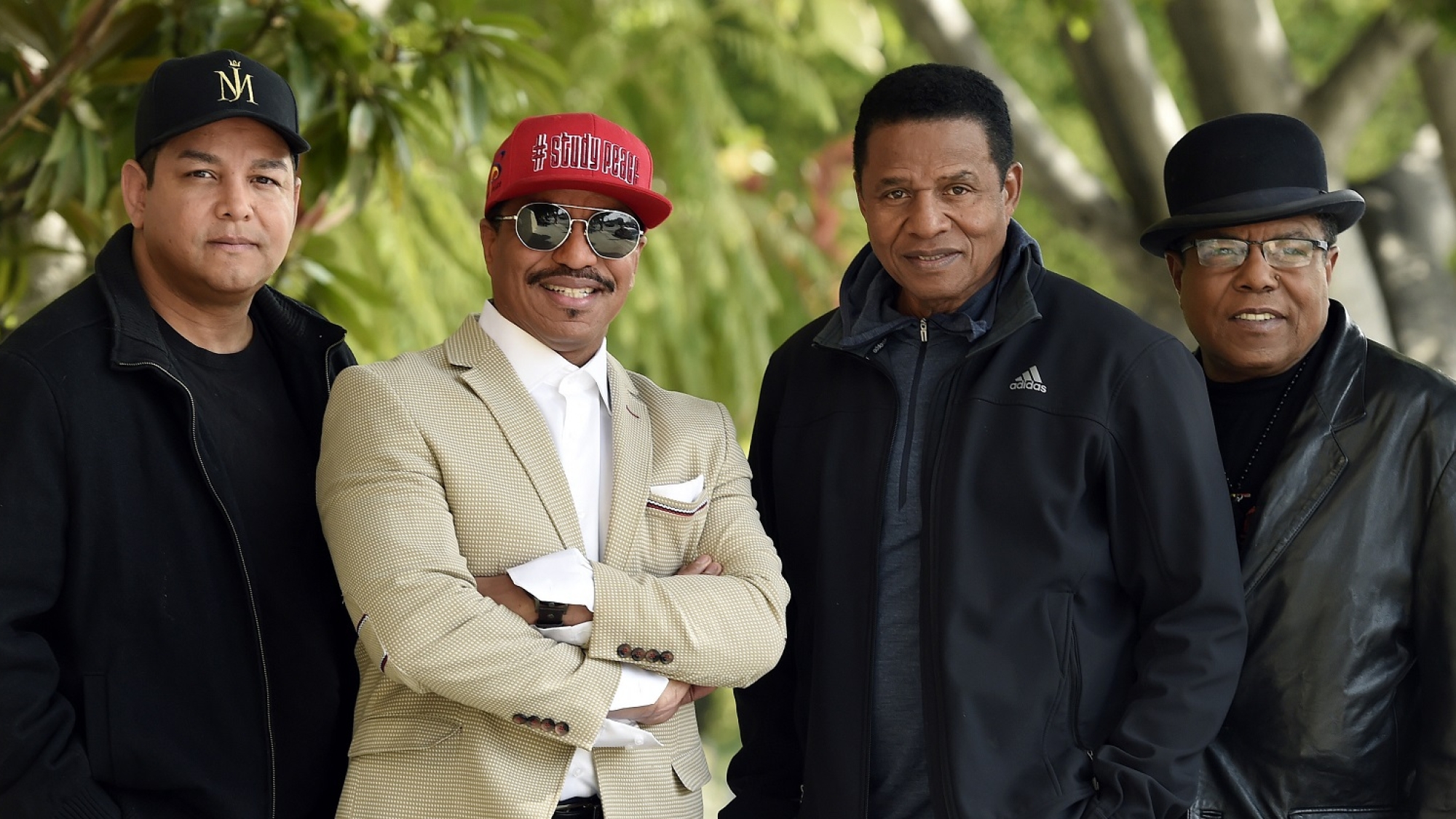 In this Tuesday, Feb. 26, 2019 photo, Marlon Jackson, second from left, Jackie Jackson, second from right, and Tito Jackson, far right, brothers of the late singer Michael Jackson, and Tito's son Taj, far left, pose together for a portrait outside the Four Seasons Hotel, in Los Angeles. The brothers gave the first family interviews Tuesday on “Leaving Neverland,” which features two Michael Jackson accusers and is set to air on HBO starting Sunday. (Photo by Chris Pizzello/Invision/AP)
