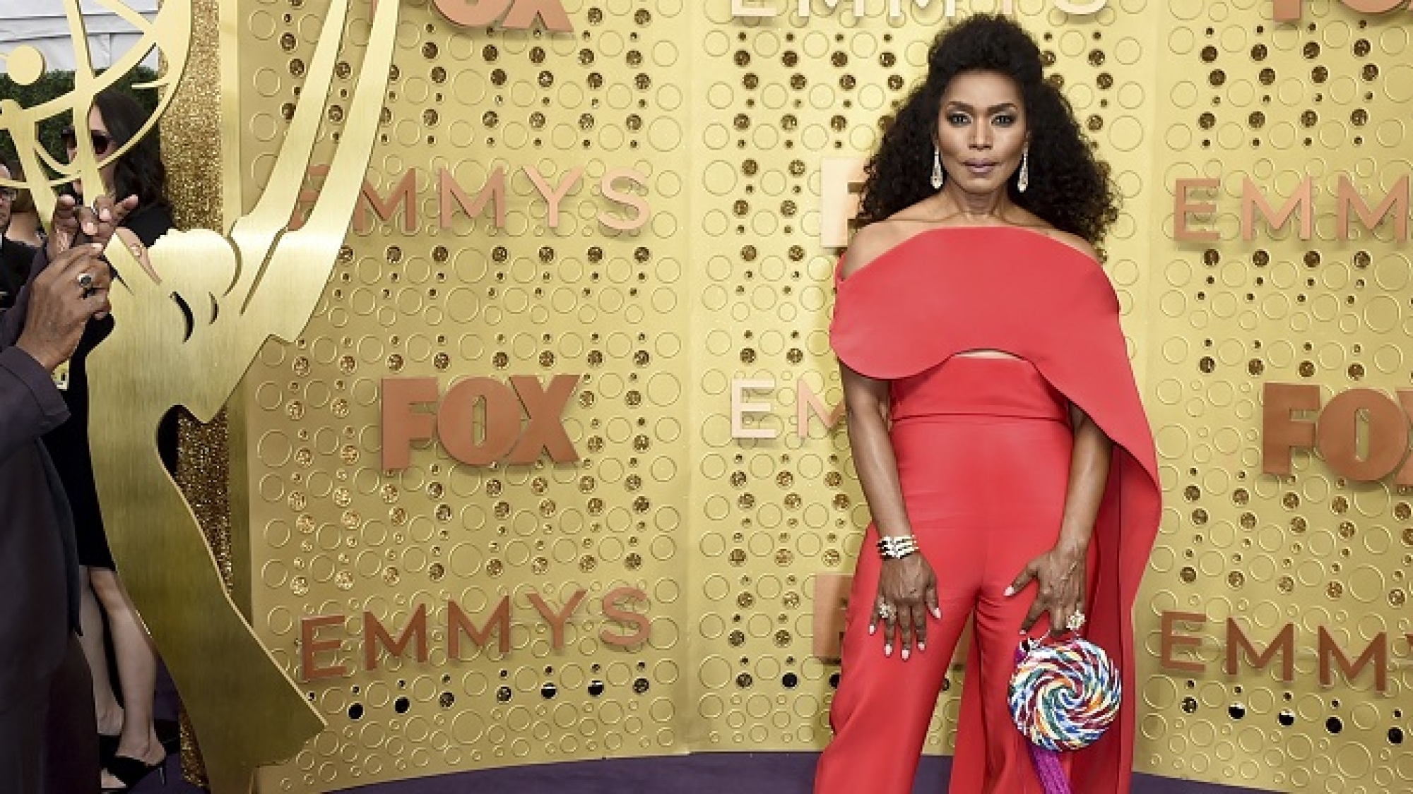 Courtney B. Vance, left, takes a photograph of Angela Bassett as they arrive at the 71st Primetime Emmy Awards on Sunday, Sept. 22, 2019, at the Microsoft Theater in Los Angeles. (Photo by Jordan Strauss/Invision/AP)