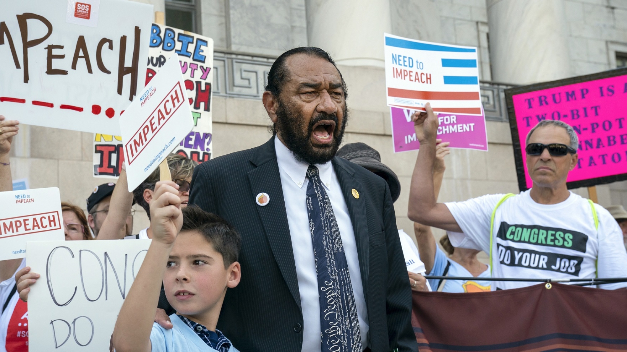 Rep. Al Green, D-Texas, joins impeachment activists with a youth-led group, By The People, to call for Congress to remove President Donald Trump from office, outside the Rayburn House Office Building on Capitol Hill in Washington, Monday, Sept. 23, 2019. Rep. Green, joined by Alex Meltzer, 9, of Boston, has pressed for Trump's impeachment three times. (AP Photo/J. Scott Applewhite)