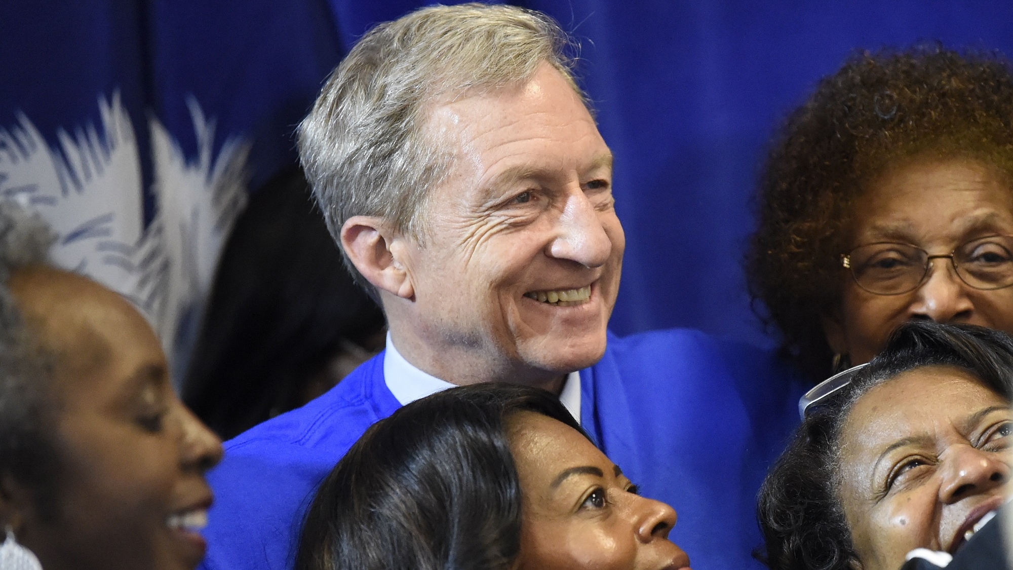 Democratic presidential candidate Tom Steyer poses with members of a Democratic women's group after an event on Saturday, Jan. 18, 2020, in Hartsville, S.C. (AP Photo/Meg Kinnard)