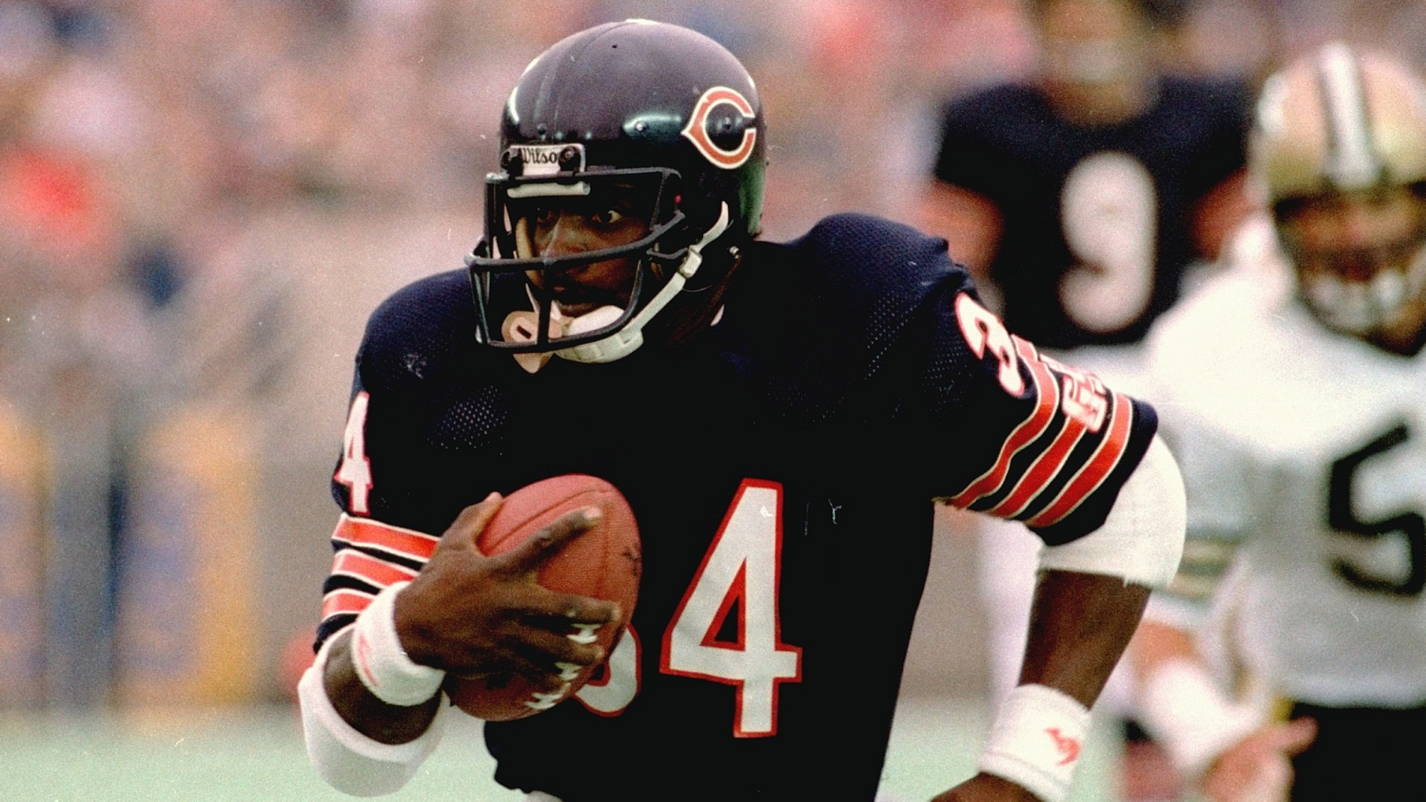 This is an October 8, 1984  photo of the Chicago Bears' Walter Payton in action looking for an opening during a game against the New Orleans Saints.  (AP Photo/ Fred Jewell)