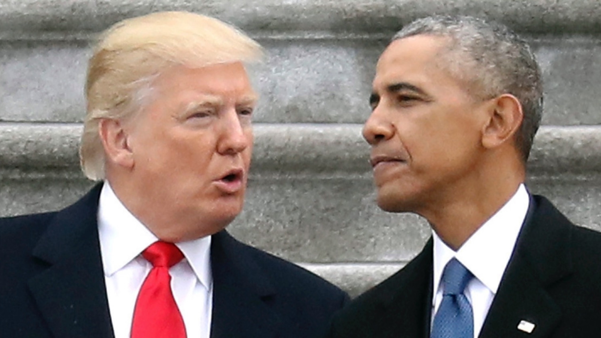 In this Friday, Jan. 20, 2017, file photo, President Donald Trump talks with former President Barack Obama on Capitol Hill in Washington, prior to Obama's departure to Andrews Air Force Base, Md. Trump relentlessly congratulates himself for the healthy state of the U.S. economy. But in the year since Trump’s inauguration, most analysts tend to agree on this: The economy remains essentially the same sturdy one he inherited from Obama. (Rob Carr/Pool Photo via AP, File)