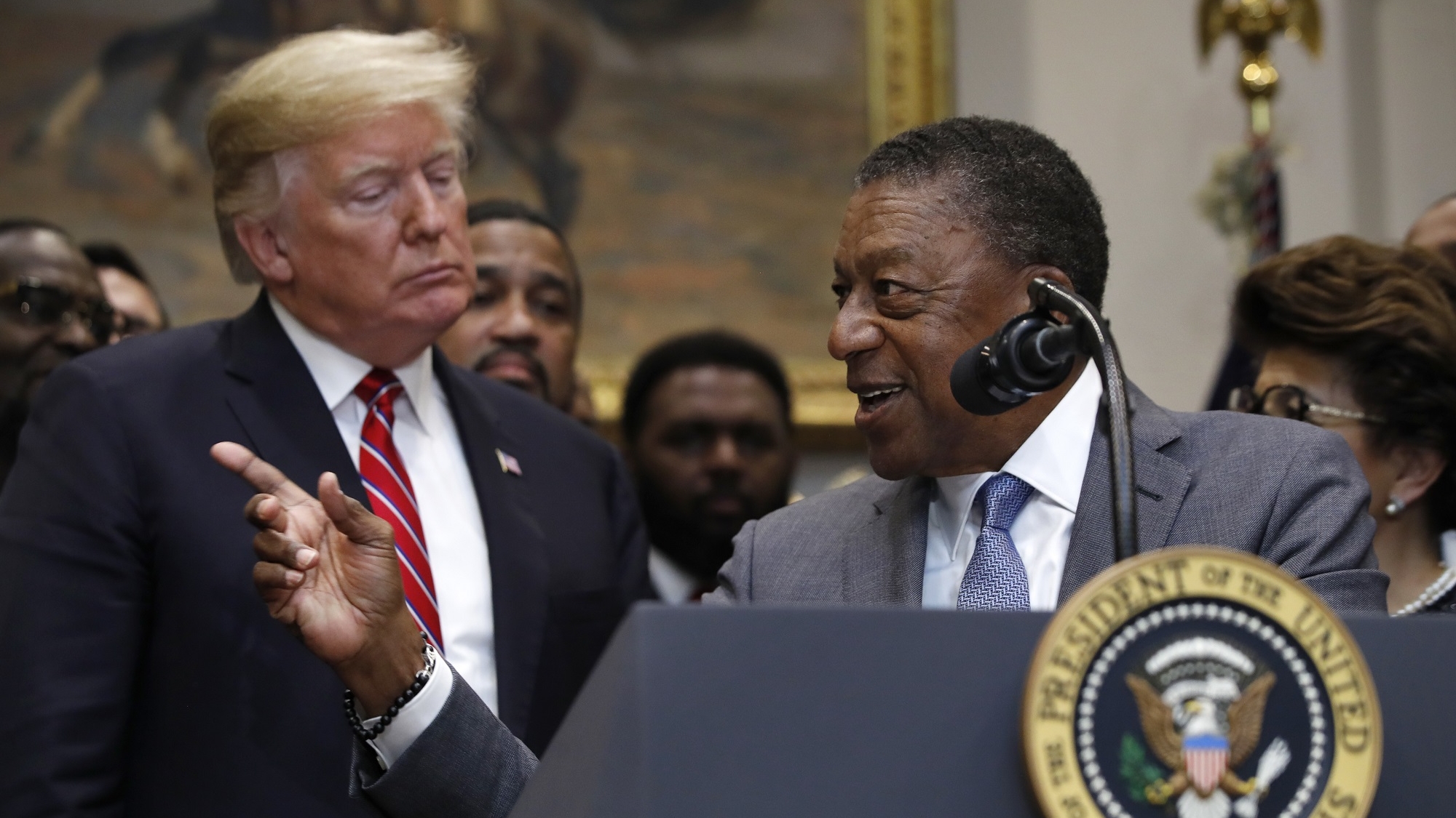 Bob Johnson, founder of BET, right, gestures as he speaks next to President Donald Trump during a ceremony for the signing of an executive order establishing the White House Opportunity and Revitalization Council, in the Roosevelt Room of the White House, Wednesday, Dec. 12, 2018, in Washington. (AP Photo/Jacquelyn Martin)