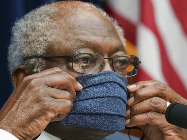 Committee Chairman Rep. James Clyburn, D-S.C.,  adjusts his protective face mask as he chairs  a House Select Subcommittee on the Coronavirus Crisis hearing on the response "The Administration Response to Ongoing Shortages of PPE and Critical Medical Supplies", Thursday, July 2, 2020 on Capitol Hill in Washington. (Kevin Lamarque/Pool via AP)