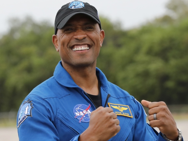NASA Astronaut Victor Glover is all smiles during a news conference after he arrived at the Kennedy Space Center, Sunday, Nov. 8, 2020, in Cape Canaveral, Fla. Four astronauts will fly on the SpaceX Crew-1 mission to the International Space Station scheduled for launch on Nov. 14, 2020. (AP Photo/Terry Renna)