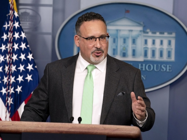 FILE - In this March 17, 2021, file photo, Education Secretary Miguel Cardona speaks during a press briefing at the White House in Washington. The U.S. Education Department on Wednesday, June 16, expanded its interpretation of federal sex protections to include transgender and gay students, a move that reverses Trump-era policy and stands against proposals in many states to bar transgender girls from school sports. In announcing the shift, Cardona said gay, lesbian and transgender students “have the same rights and deserve the same protections” as workers. (AP Photo/Andrew Harnik, File)