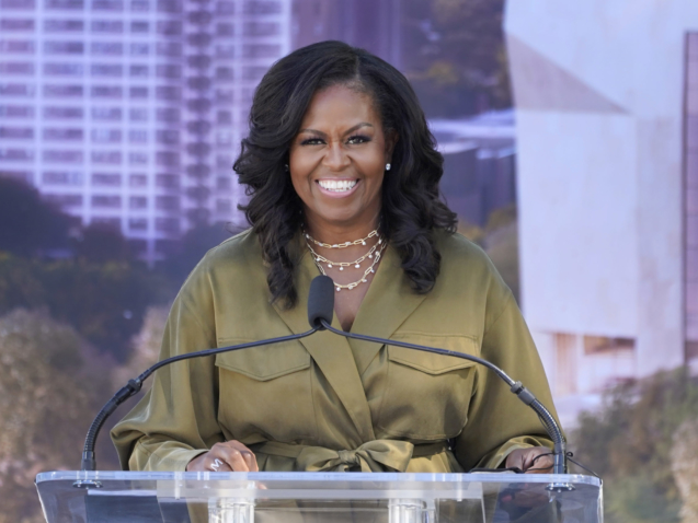 Former first lady Michelle Obamad smiles as she speaks during a groundbreaking ceremony for the Obama Presidential Center Tuesday, Sept. 28, 2021, in Chicago. (AP Photo/Charles Rex Arbogast)