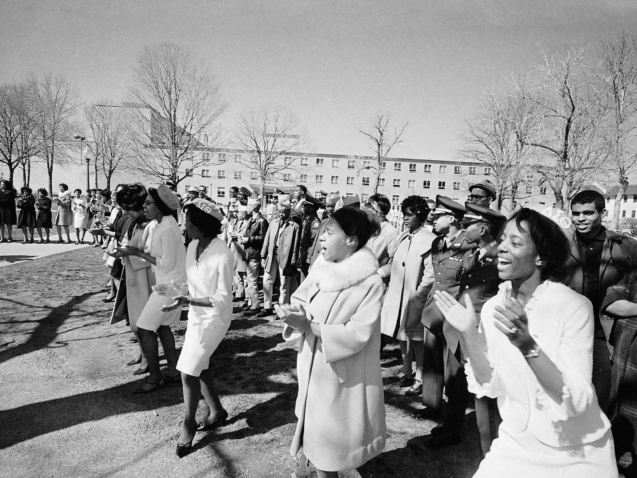 Harlem youth cadets watch pledges of Delta Sigma Theta sorority sing and dance during a visit to the Howard University campus in Washington, April 3, 1965. (AP Photo/Charles Tasnadi)