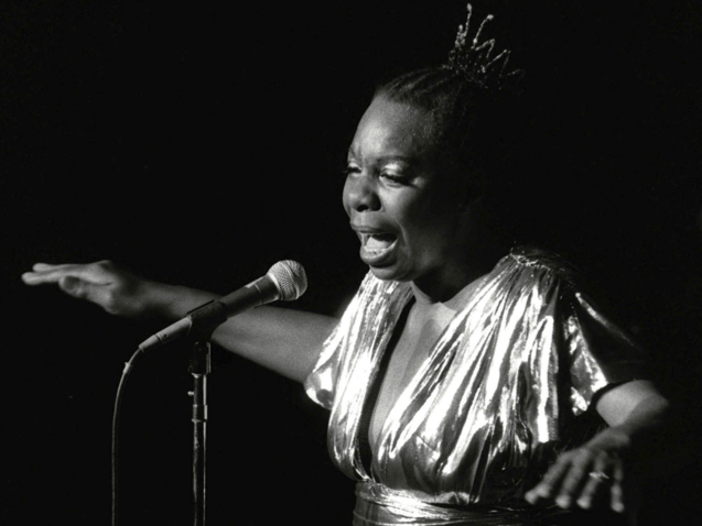 FILE - In this June 27, 1985, file photo, Nina Simone performs at Avery Fisher Hall in New York. The childhood home of the iconic musician and civil rights activist will be indefinitely preserved in North Carolina. The National Trust for Historic Preservation announced Tuesday, Sept. 8, 2020, that its African American Cultural Heritage Action Fund, in partnership with World Monuments Fund and Preservation North Carolina, recently secured permanent protection of the singer-songwriter’s childhood home in Tryon.  (AP Photo/Rene Perez, File)