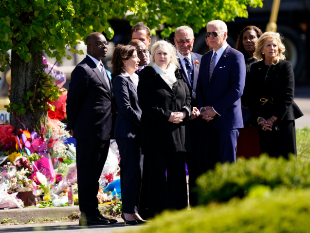 President Joe Biden and first lady Jill Biden meet with officials including, Buffalo Mayor Byron Brown, left, New York Gov. Kathy Hochul, Sen. Kirsten Gillibrand, D-N.Y., Senate Majority Leader Chuck Schumer of N.Y., and New York Attorney General Letitia James, as they visit the scene of a shooting at a supermarket to pay respects and speak to families of the victims of Saturday's shooting in Buffalo, N.Y., Tuesday, May 17, 2022. (AP Photo/Matt Rourke)