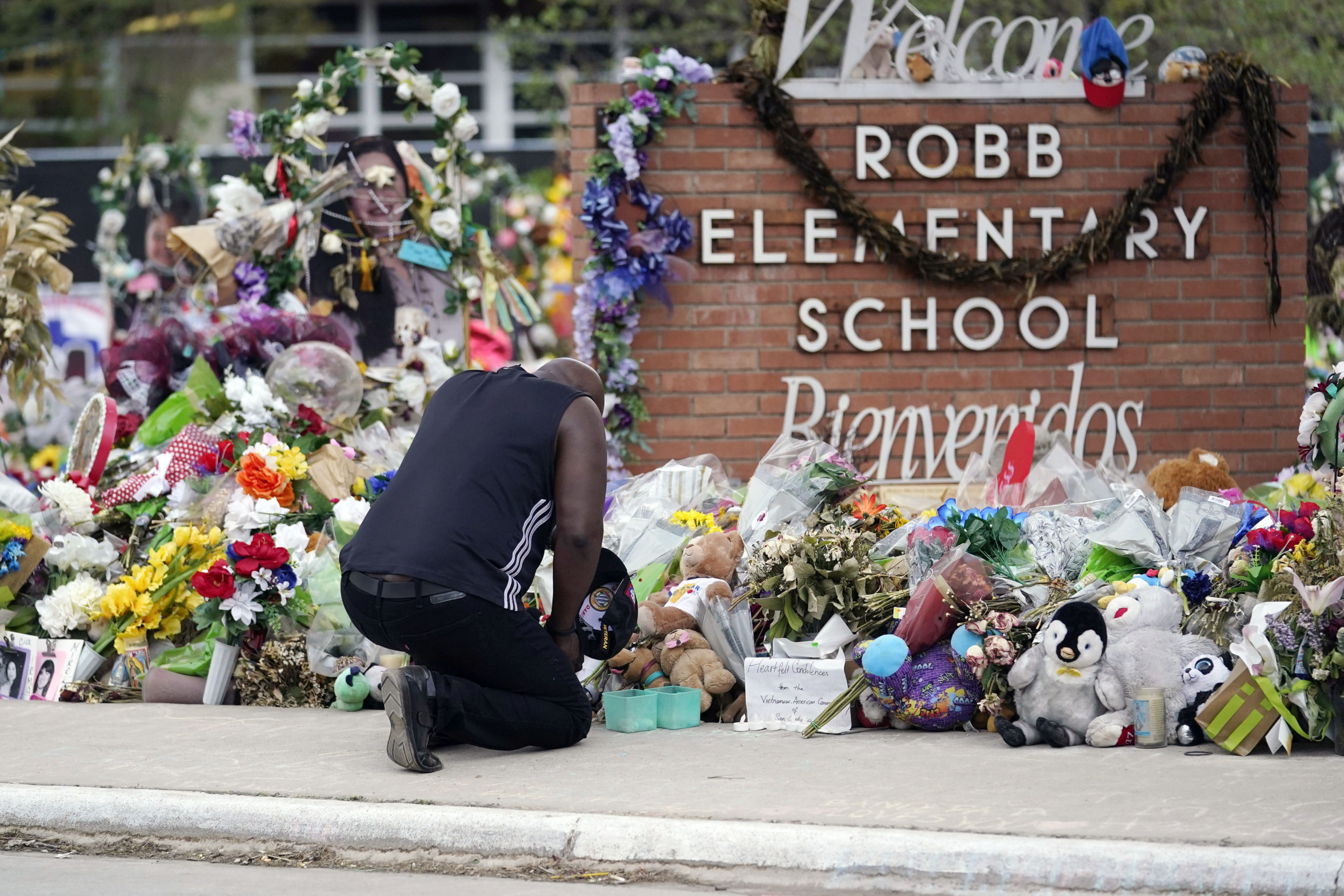 Reggie Daniels pays his respects at a memorial at Robb Elementary School in Uvalde, Texas, on June 9, 2022