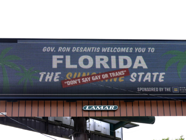 A new billboard welcoming visitors to "Florida: The Sunshine 'Don't Say Gay or Trans' State' is seen Thursday, April 21, 2022, in Winter Park, Fla. Billboards, which are being placed in key areas with high visitor traffic and visibility, are part of a new advertising campaign launched by the Human Rights Campaign (HRC). (AP Photo/John Raoux)