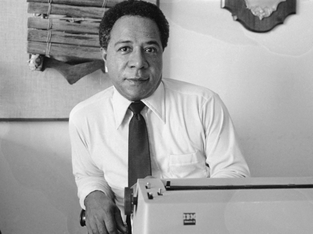 FILE - Writer Alex Haley, who traced his family back to Africa poses in his San Fransisco apartment May 16, 1974. The miniseries "Roots" debuts on ABC based on a book by Haley and runs through Jan. 30 attracting record ratings, with the finale drawing a 71% share of the TV audience. (AP Photo, File)